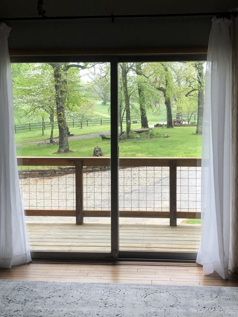 Bunk room view of front driveway out to hayfields.