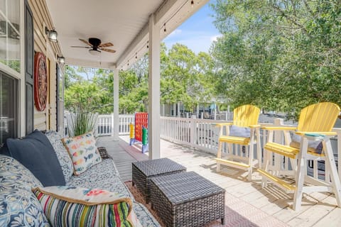 Sunny porch retreat with cozy seating and vibrant bar stools