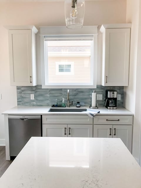 Kitchen sink, new Bosch dishwasher and dreamy backsplash.