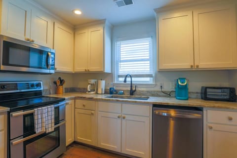 The kitchen is equipped with a dishwasher, range, microwave, toaster oven, keurig and drip coffee maker.
