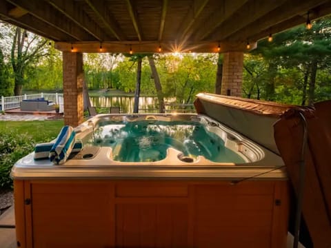 Enjoy the views of the river from the hot tub that seats 6 to 7 people. 