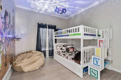 Woody theme on the bottom bunk and Buzz Lightyear theme on the top. The bunk bed also has a pullout trundle for extra sleeping and a bean bag for watching TV!