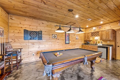 Pool table, darts, and mini bar