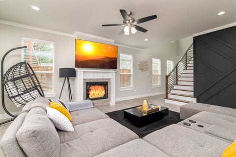 Unwind in the living that features a big HDTV, sectional, and hammock chair! 