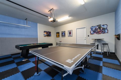 Themed games room with ping pong and pool tables