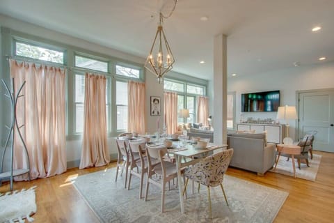 Open concept living is perfectly suited to entertain family or friends, with a dining table that seats 8 and additional bar seating.