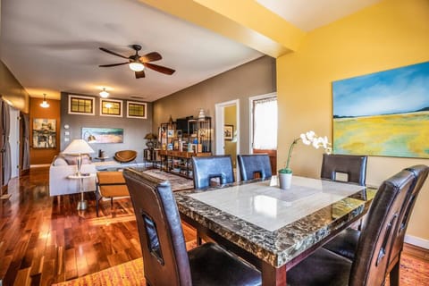 Dining table with room for six and living room.