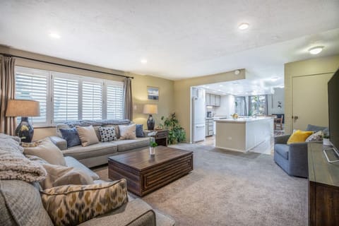 A living room boasting plenty of pillows for lounging.
