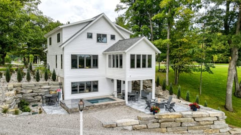 Lakeside of the house. Private Hot Tub, Outdoor Shower, Gas Grill and Fire pit.