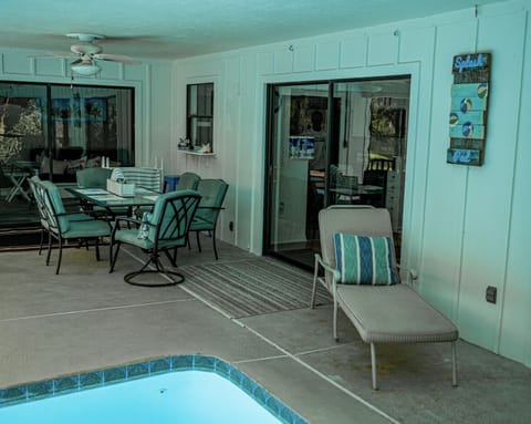 Dining table on back (screened porch).