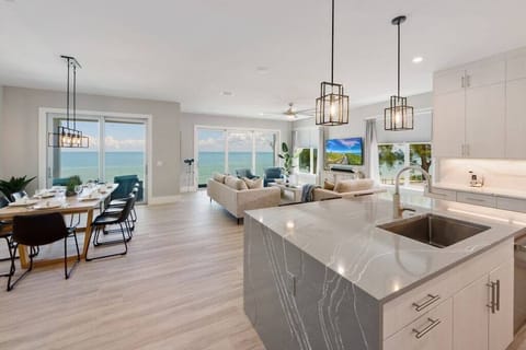 Relax in our modern abode where the living room view sets sail like a cruise ship over the sea. Book for a nautical illusion with all the comforts of land.