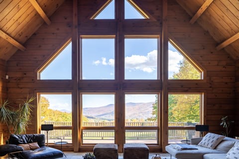 Oversized windows in the living room frame the views of the Hunter ski slopes.