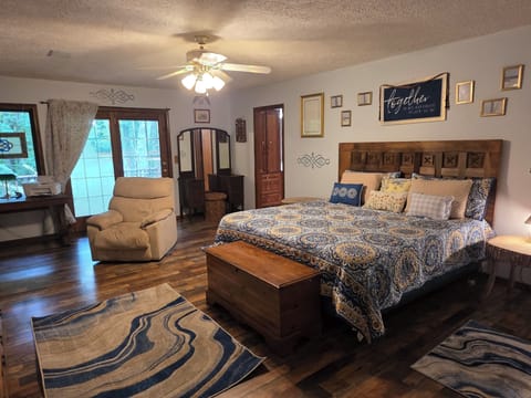 Master Bedroom: WV and Celtic touches, Views of nature, deck doors to hot tub.