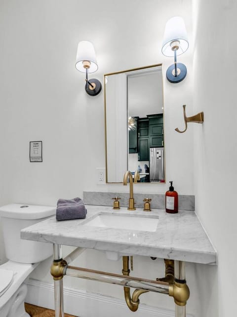 Stylish Bathroom: Elegant marble vanity with modern fixtures for your refreshing retreat!