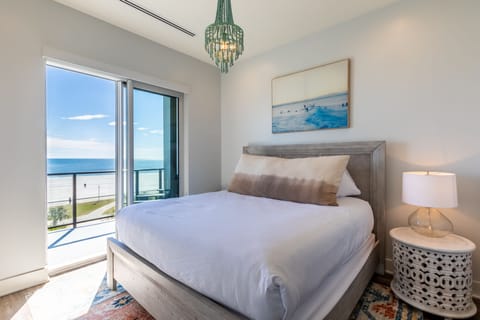 King Bedroom with en suite bathroom, Smart TV, and balcony access!