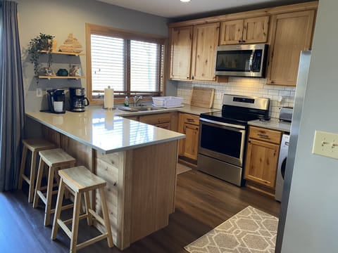 Cute kitchen is fully stocked with amenities you need to enjoy a great meal!