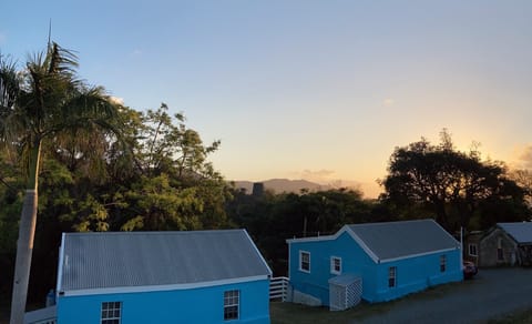 Mountainside is the Caribbean blue cottage to the left. 