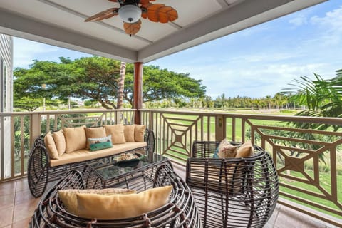 Covered lanai with golf course views and BBQ