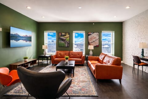 Super comfy living room with rich high grade leather sofas and 70" 4K TV.