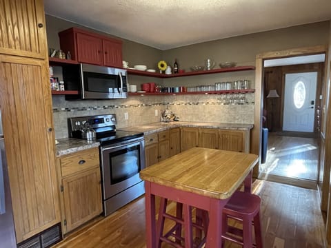 Spacious kitchen; full compliment of cookware, utensils & servicesware & pantry.