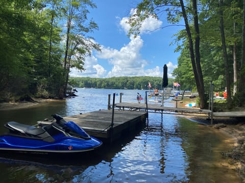Summer view of our boat dock on the property (jetski not included in rental)