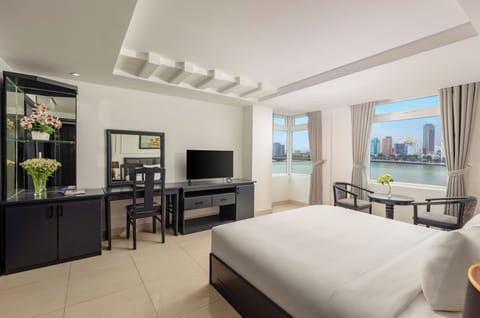 Executive Double Room, River View | Minibar, in-room safe, desk, blackout drapes