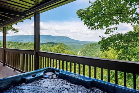 Take a soak in the hot tub on the huge front porch with amazing mountain views!