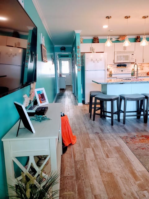 View from the living room looking toward the kitchen and bedroom 