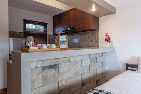 Family Room, Kitchenette | Private kitchen | Fridge, electric kettle