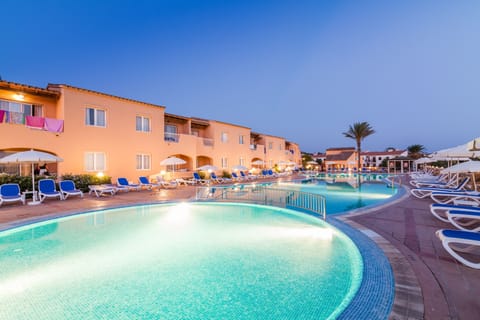 Outdoor pool, open 10:00 AM to 6:00 PM, pool umbrellas, sun loungers