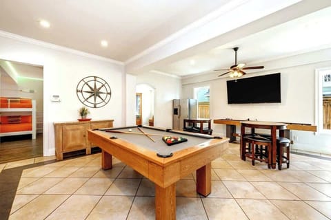 Shuffleboard, billiards, and a large TV to watch the game are perfect for the kids (or kids at heart).