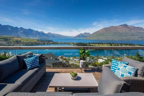 Outdoor Dining with Panoramic Views
This balcony offers a dining area with breathtaking lake and mountain views. Complete with a BBQ and cozy seating, it's ideal for enjoying meals outdoors or simply soaking in the serene surroundings.