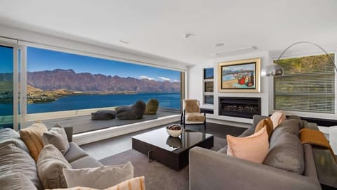 Grand Living Room
Step into the expansive living room of Lorden’s Penthouse, where luxury meets comfort, featuring panoramic views and opulent furnishings for an unforgettable Queenstown experience.