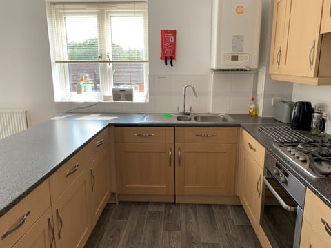 Comfort Apartment | Private kitchen | Full-size fridge, microwave, oven, stovetop