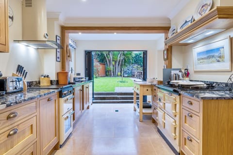 New handmade oak kitchen, granite worktops, bifold doors, electric oven, Aga.