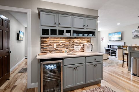 The wet bar is stocked with a selection of tea, coffee, and water!