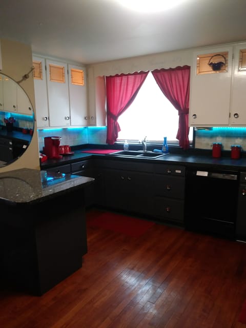 Kitchen with granite island and coffee station