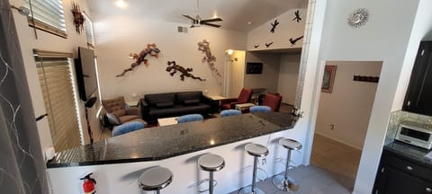 Great bar top serves as dining table. Comfortably seats 8.