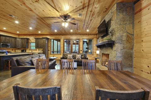 Spacious dining room featuring ample seating, complemented by additional space at the kitchen island for gatherings and entertaining.