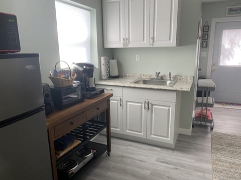 View kitchenette -microwave/medium fridge/toaster oven/stove top burners 