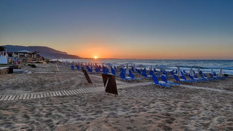 On the beach, sun loungers, beach umbrellas