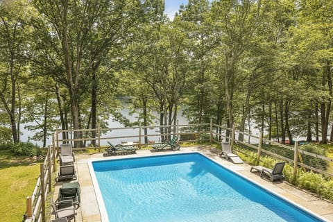 A pool with a view. This private lakefront retreat features a sparkling pool.