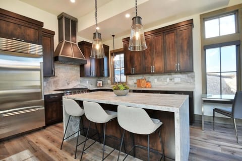 High-end Stainless Steel Appliances Include a Wolf Gas Range and a SubZero Refrigerator