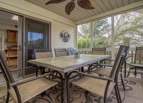 Off the kitchen sliding doors lead to the screen porch.