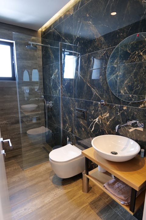 Deluxe Double Room, Partial Sea View | Bathroom | Shower, soap, toilet paper