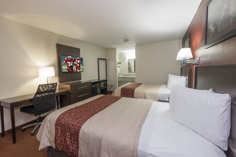 Deluxe Room, 2 Queen Beds, Non Smoking | Desk, laptop workspace, blackout drapes, iron/ironing board