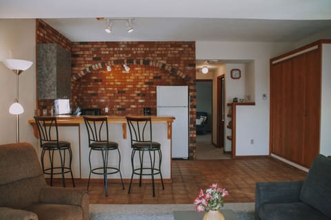 The open living/dining/kitchen is bright and sunny with views!