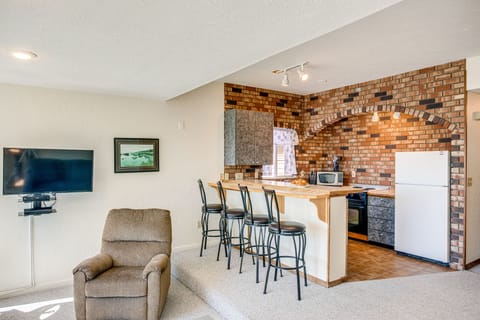 Sit at the bar and keep the cook company.