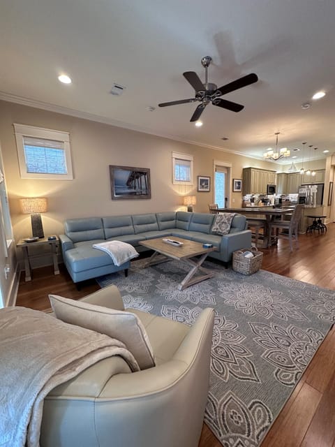 View of the Living/Dining/Kitchen from the front of the living room, looking back towards the kitchen. 