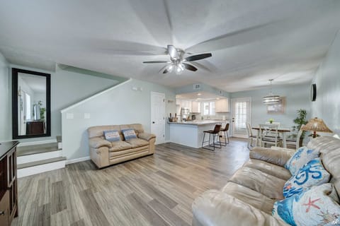 Living room with kitchen and dining area.